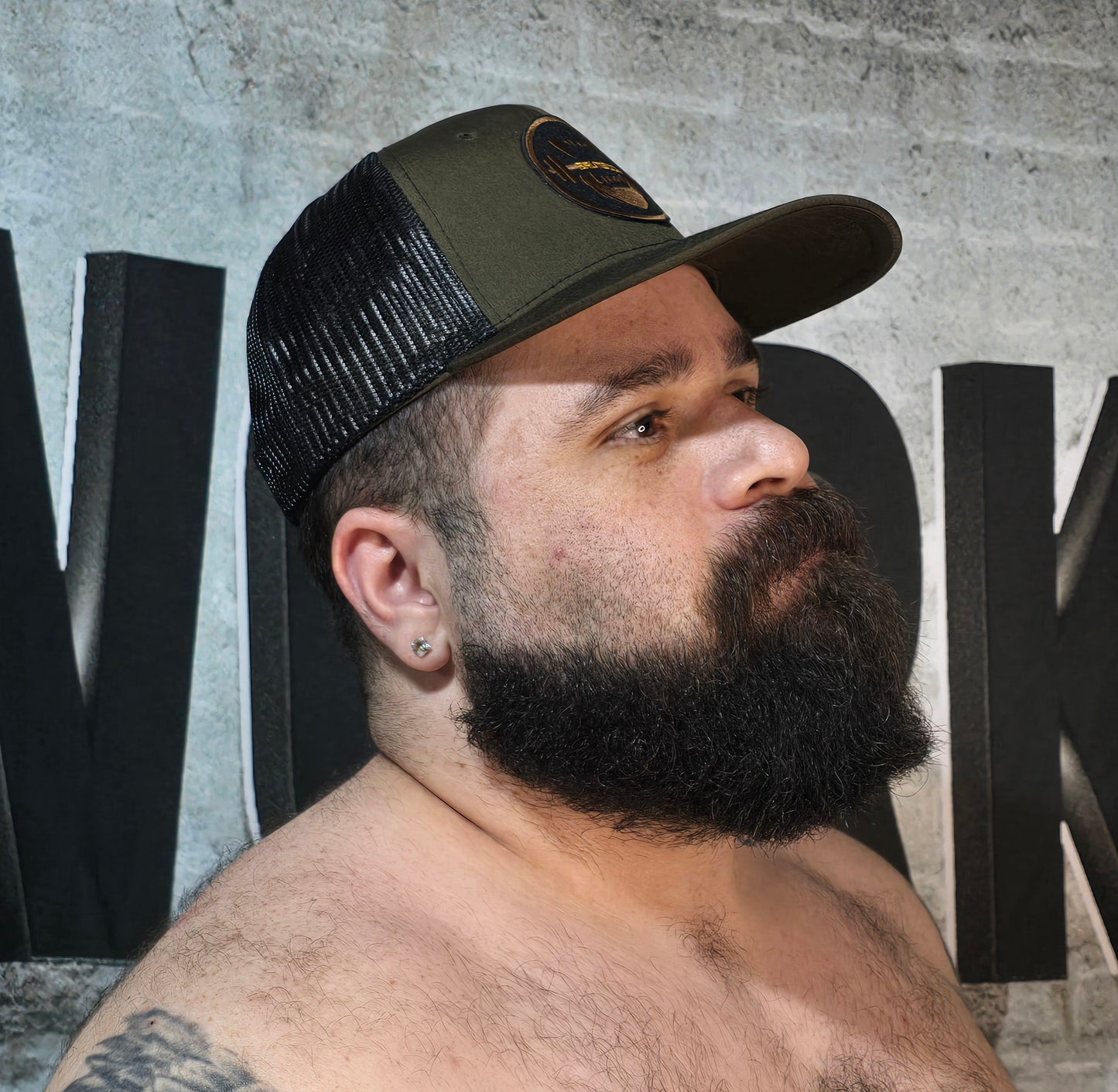 Brute Co Round Brown and Orange Logo on a Hunter Green Snapback