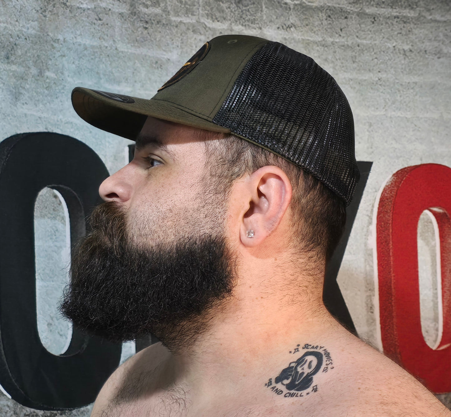Brute Co Round Brown and Orange Logo on a Hunter Green Snapback