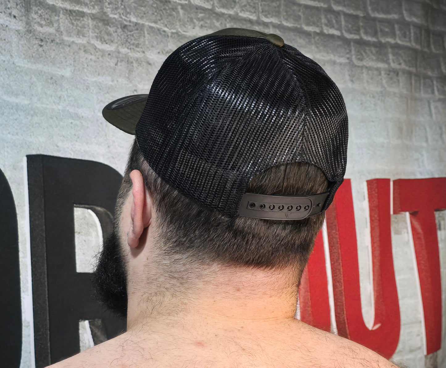 Brute Co Round Brown and Orange Logo on a Hunter Green Snapback