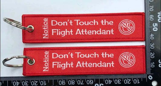 "DON'T TOUCH THE FLIGHT ATTENDANT" bag tag